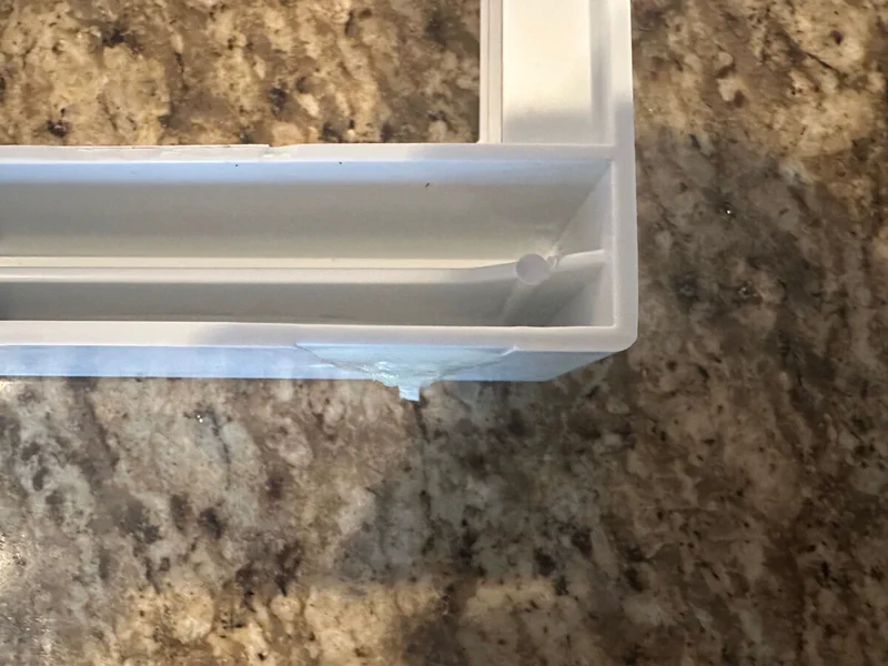 Bottom of the shelf that the new bracket needs to fit into