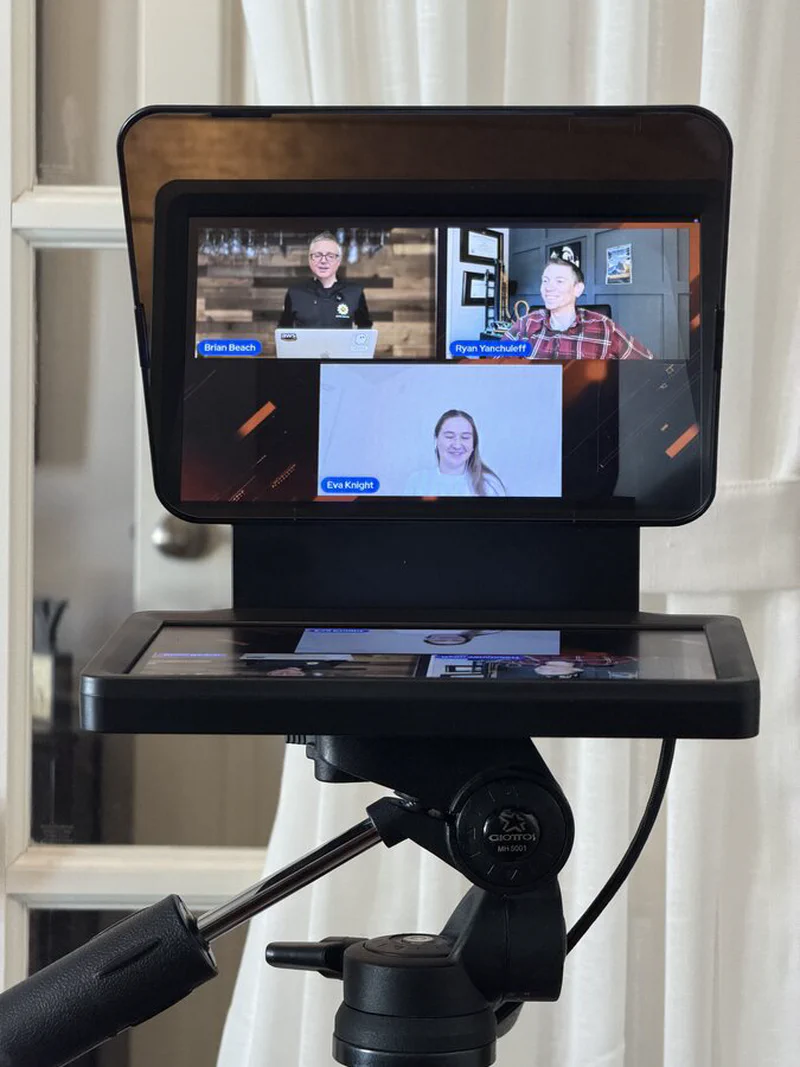 The prompter showing a video call guest on screen. The setup allows for natural eye contact during remote conversations.